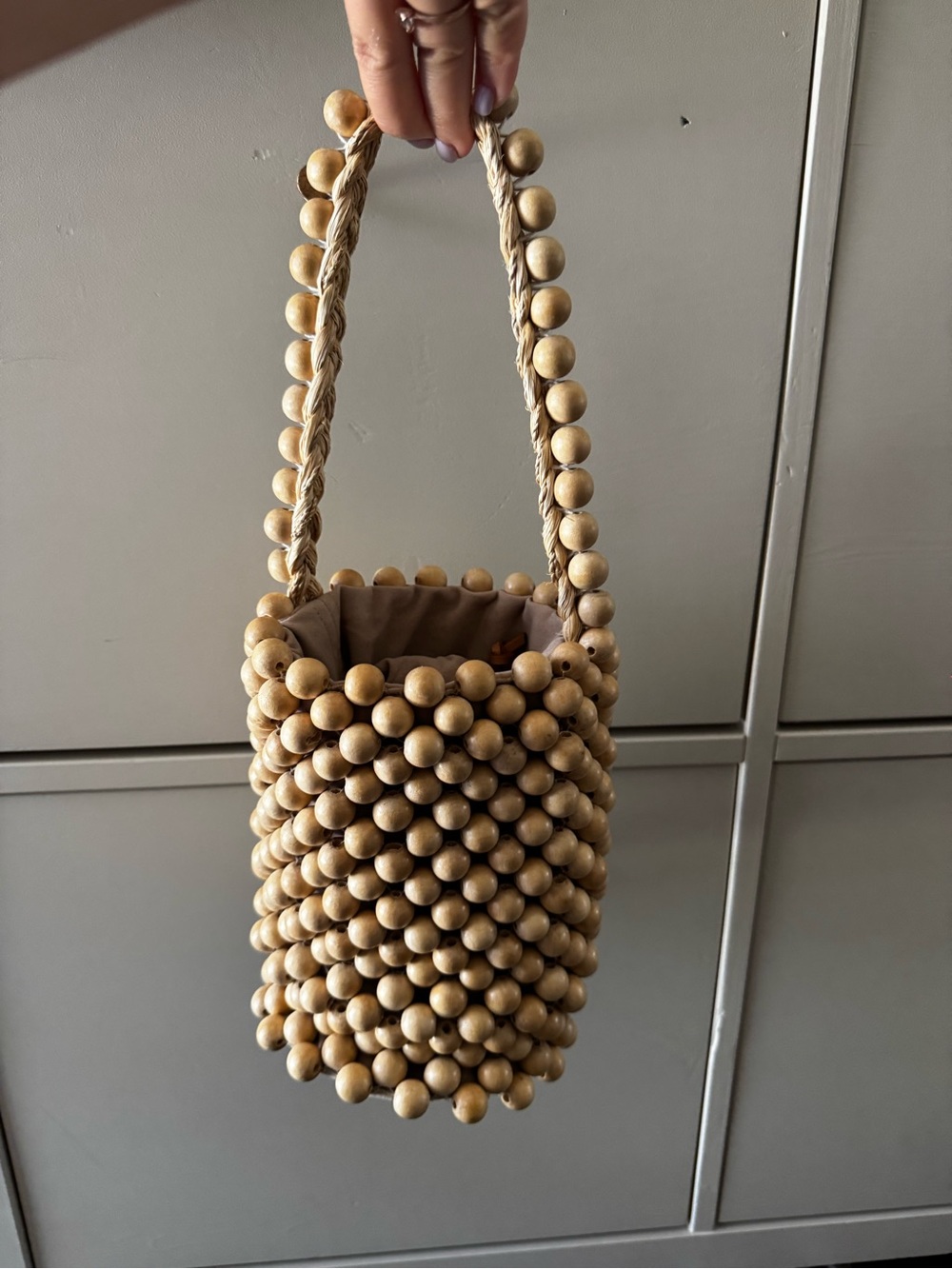 Aranaz "Punto" bucket bag in wood beads